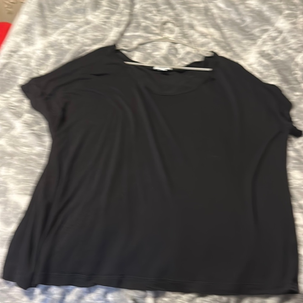 This is a black shirt that was worn once and is still in very good condition!